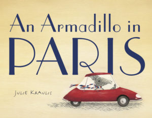An Armadillo in a red sports car driving off the front cover of this picture book.